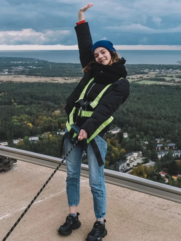 a-young-woman-walking-on-the-roo-1